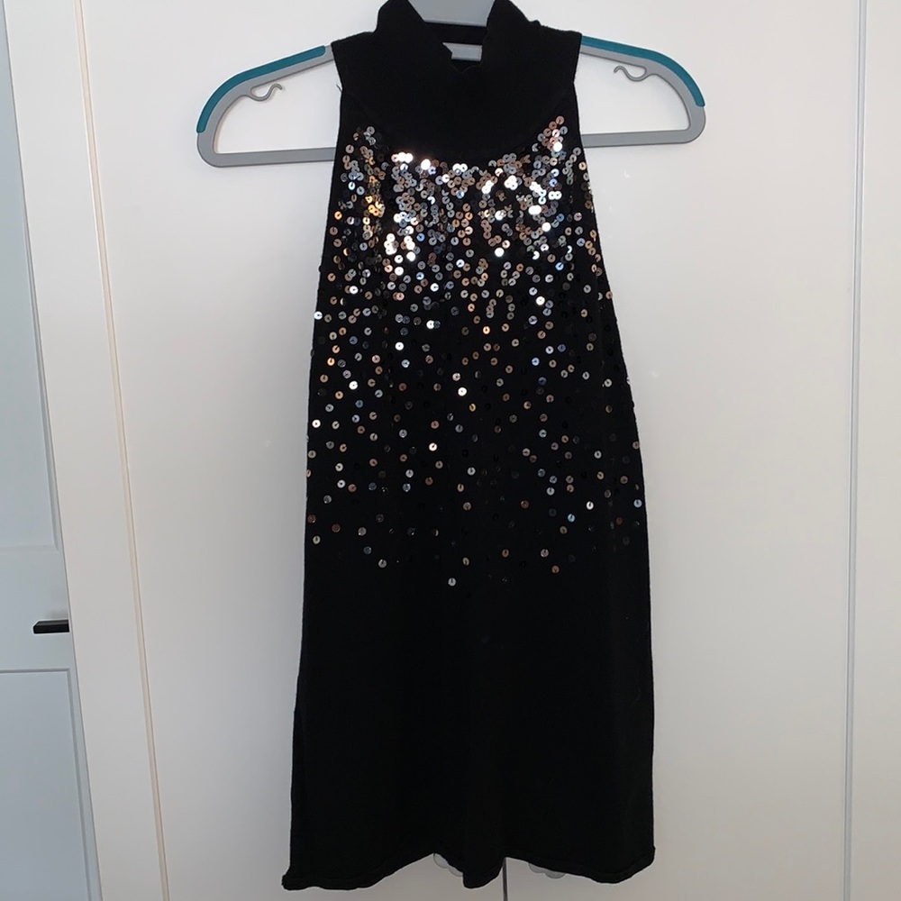 Black sleeveless turtleneck
